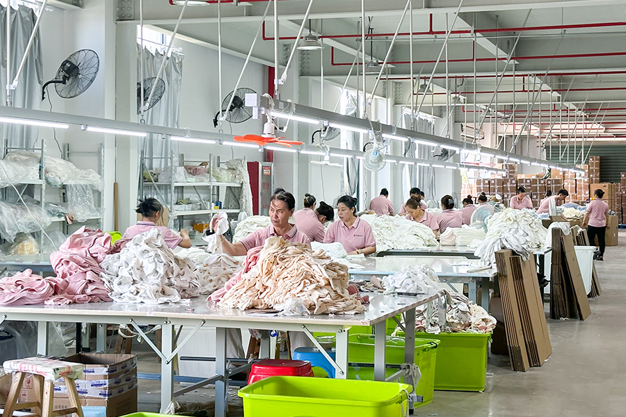 Cotbaby quality control workshop for baby textile manufacturing and inspection processes
