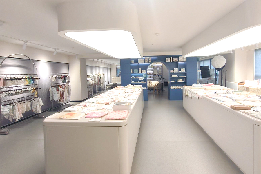 Cotbaby exhibition hall displaying baby textile product samples for wholesale buyers